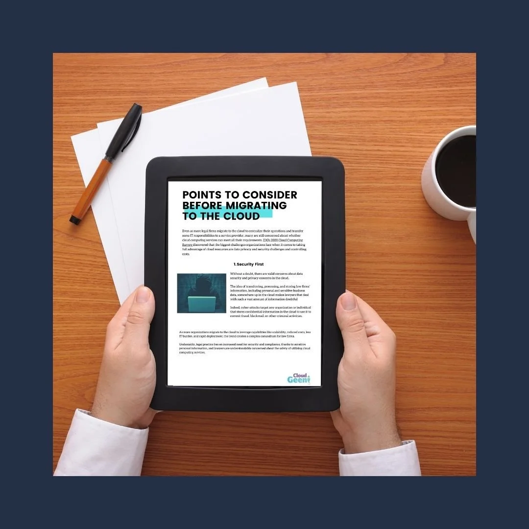 Holding tablet above table with info on cloud computing in legal firms displayed