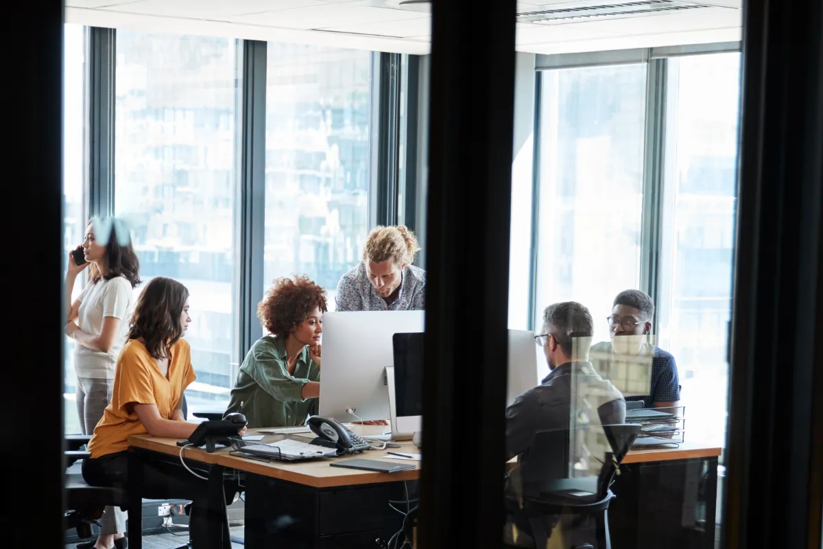 business team discussing with collaborators sat around table